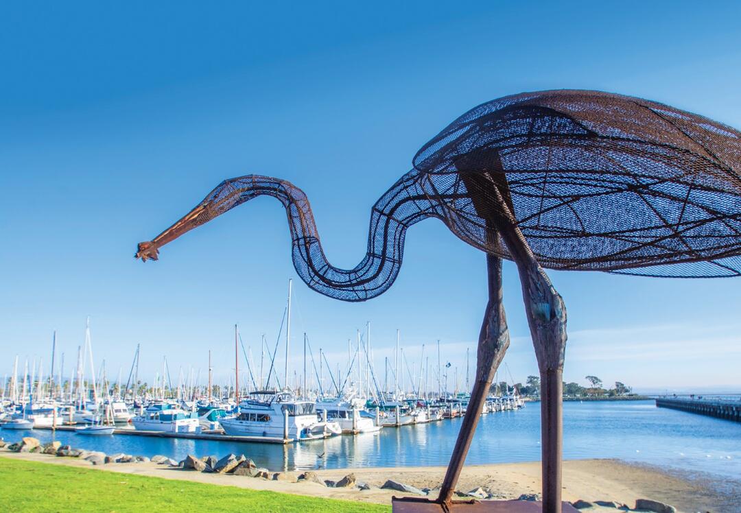 A sculpture of a bird made out of metal overlooks the Chula Vista Marina