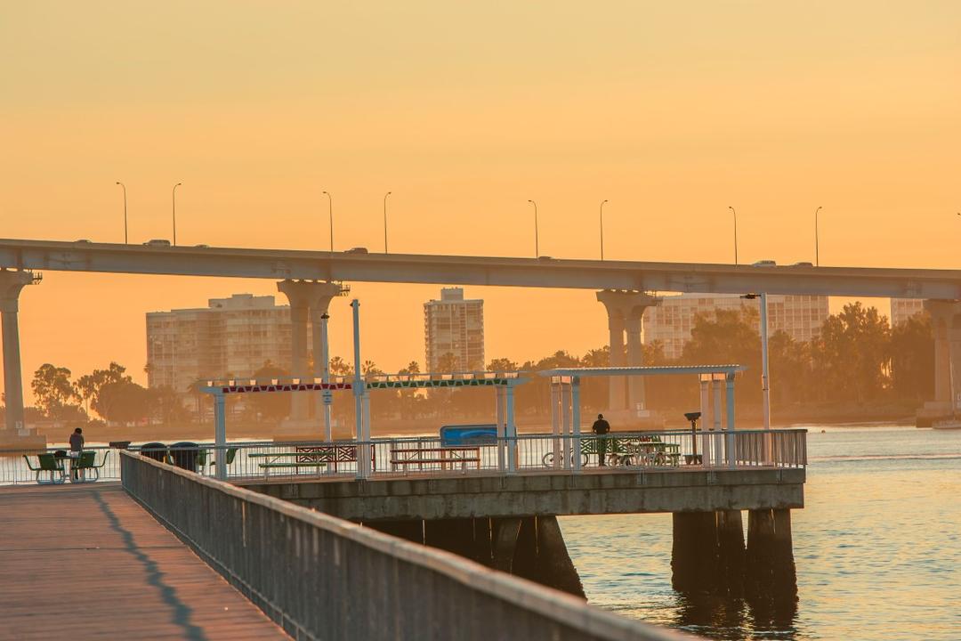 Beautiful view of the Coronado Bridge and waterfront from the recreational pier at Cesar Chavez Park at the Port of San Diego