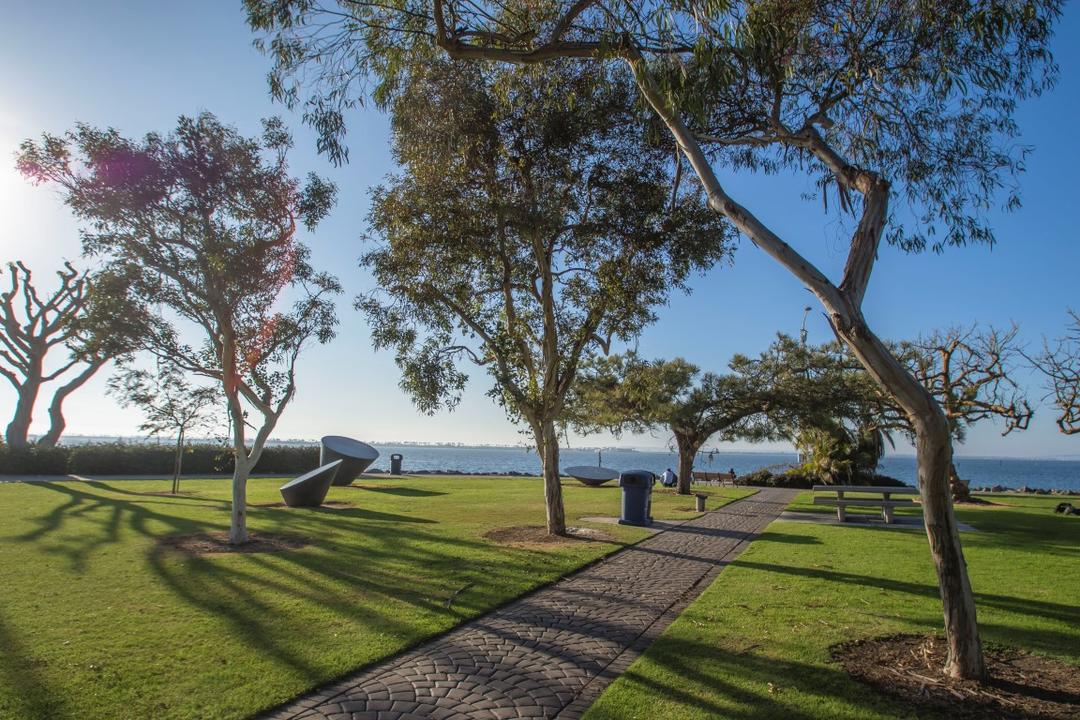 Trees and walkway along Konoids art sculptures at Chula Vista Bayfront Park at the Port of San Diego