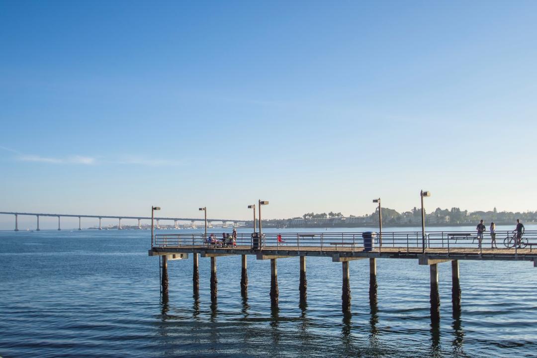 Fishing pier and view of the San Diego-Coronado Bay Bridge at Embarcadero Marina Park South at the Port of San Diego