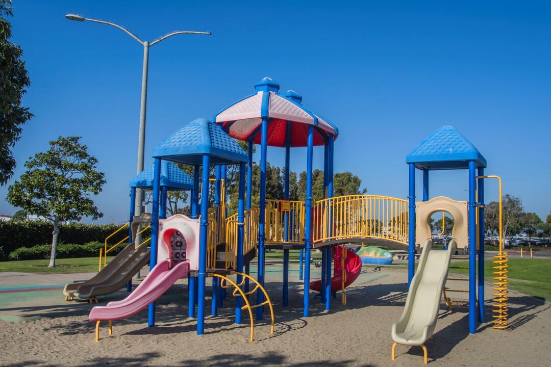 Playground over sand with slides and ladders at Pepper Park at the Port of San Diego