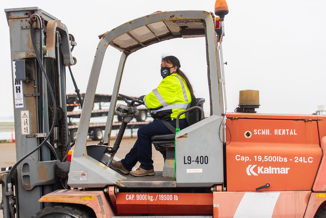 ILWU Local 29 worker operates a forklift on a maritime terminal