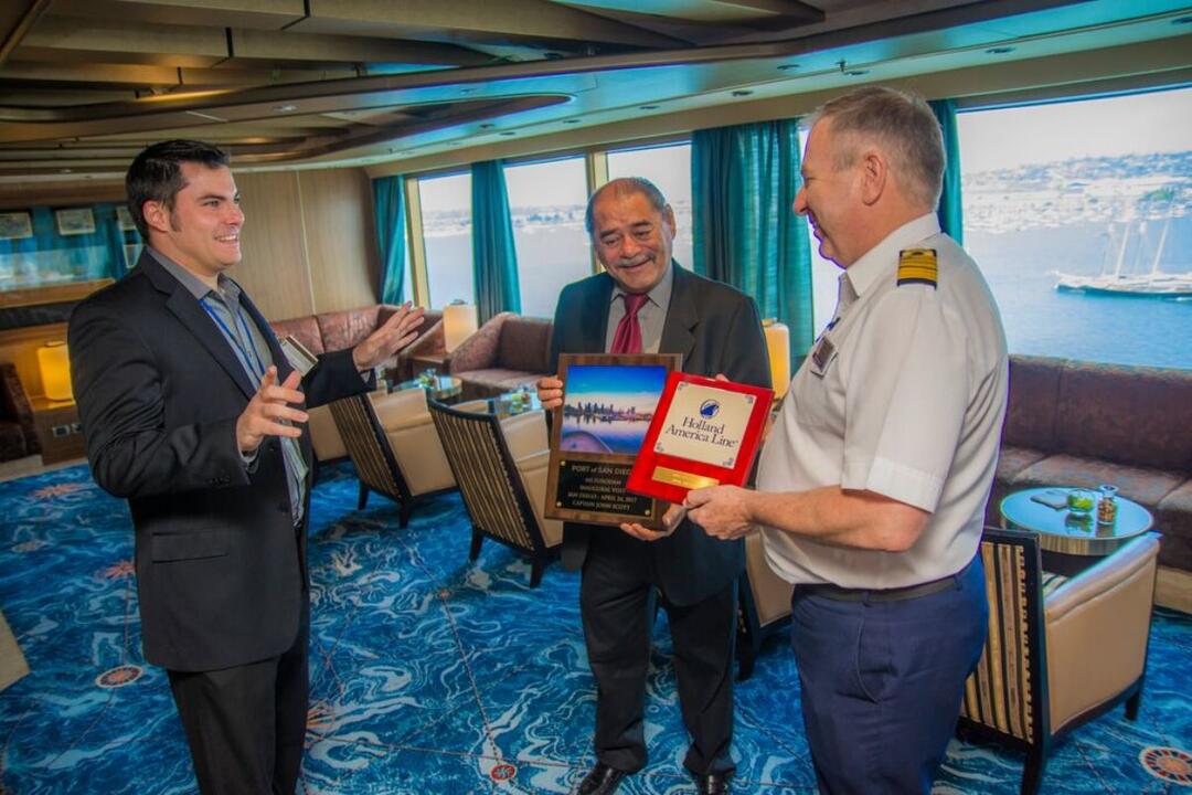 three men on the bridge of a cruise ship