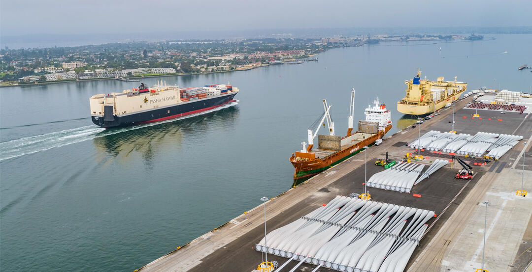 Aerial view of San Diego Bay with a ship sailing by the Tenth Avenue Marine Terminal.