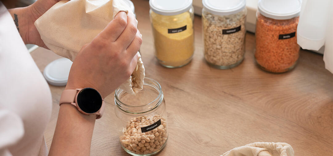 hands pouring a product into a container