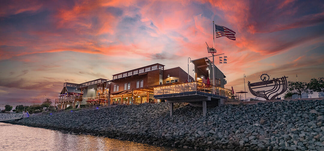 sunset of pink and blue over the National City Aquatic Center