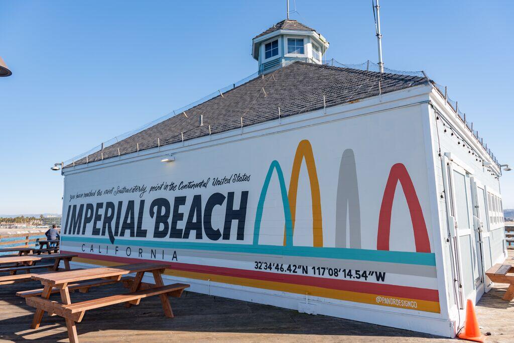 Colorful mural on the back of the Tin Fish Restaurant on the Imperial Beach Pier. The mural says, "You have reached the most southwesterly point in the continental United States. Imperial Beach California."