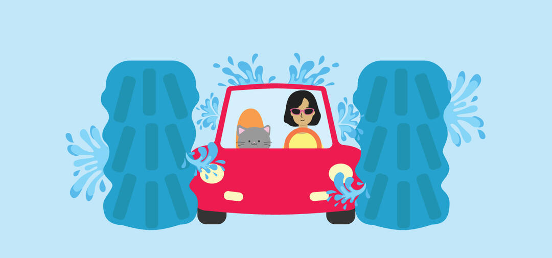 a red cartoon car goes through an automatic car wash