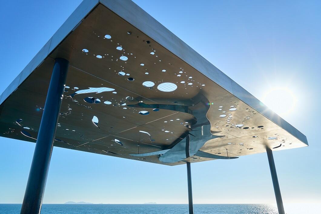 Shade canopy on the Imperial Beach Pier with a shark and water design.