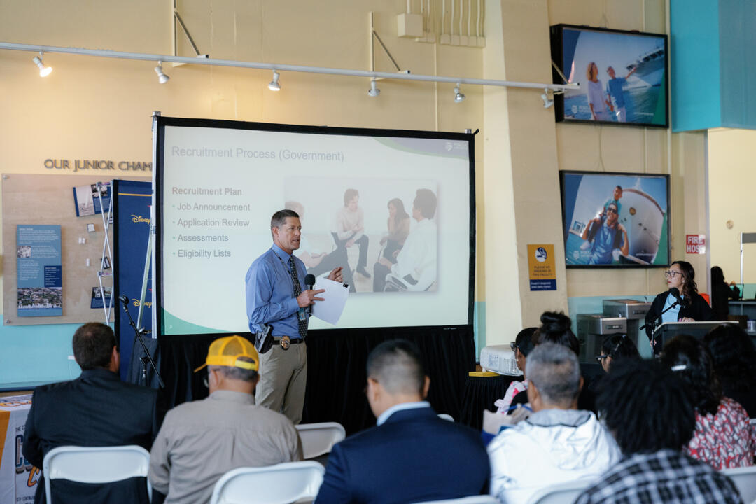 ACOP Geary explains government job applications to a group