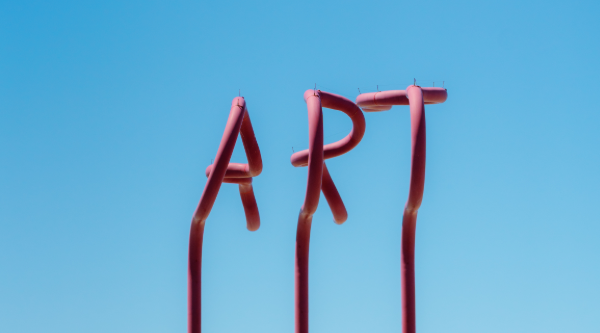 red pipes spell out "ART" in Imperial beach