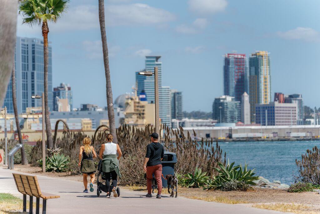 People walking by water