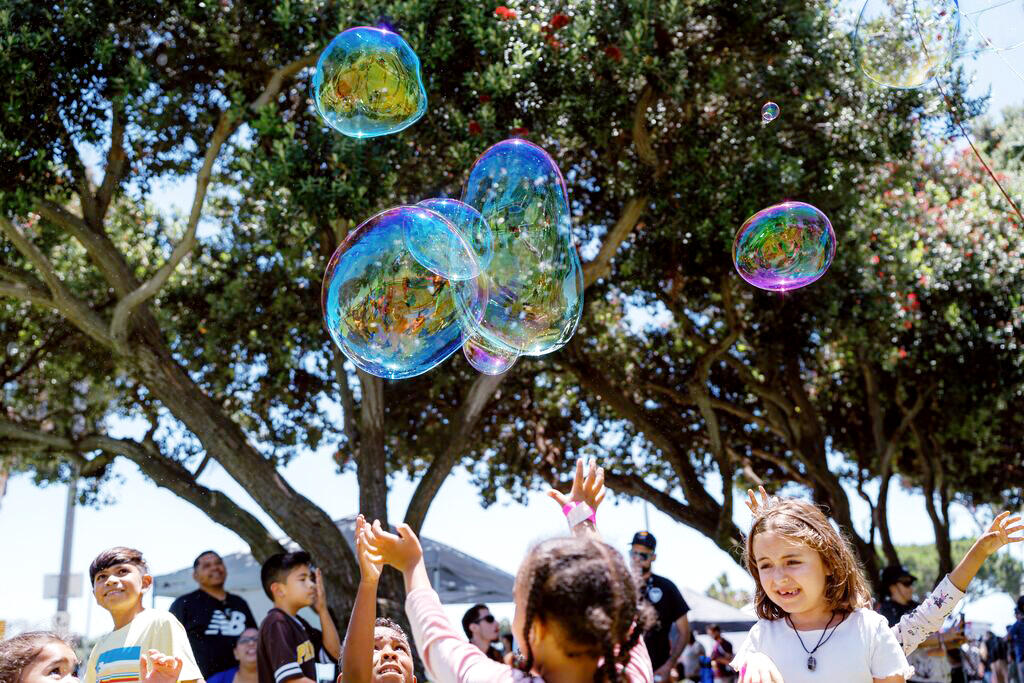 Bubble float above kids at A Day at the Park Chula Vista