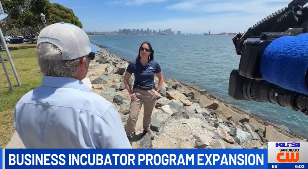 Screen shot of Port staff talking to reporter with San Diego Bay as the backdrop.