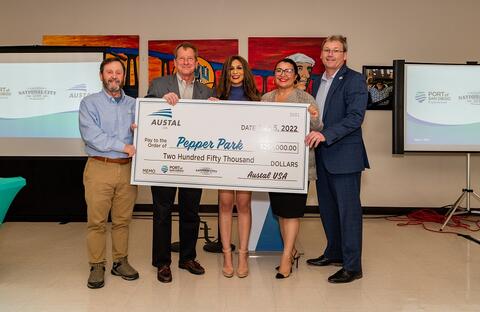 Pictured from left to right: Port President and CEO Joe Stuyvesant, Austal USA Vice President of Business Development & External Affairs Larry Ryder, Port Commissioner Sandy Naranjo, National City Mayor Alejandra Sotelo-Solis, Austal USA President Rusty Murdaugh. The group is holding a check for $250,000 for Pepper Park redesign and improvements.
