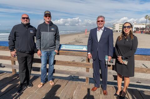 (Left to right) Imperial Beach Councilmember Matthew Leyba-Gonzalez, Imperial Beach Mayor Serge Dedina, Port of San Diego Chairman Dan Malcolm, and Imperial Beach Mayor-Elect Paloma Aguirre pose for photo around a newly-installed activity placard.