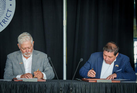 Chairman of the Port of San Diego and Director of the Port of Ensenada signing a memorandum of agreement.