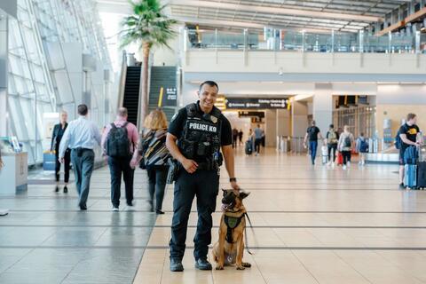 Harbor Police officer with K9 at San Diego Airport
