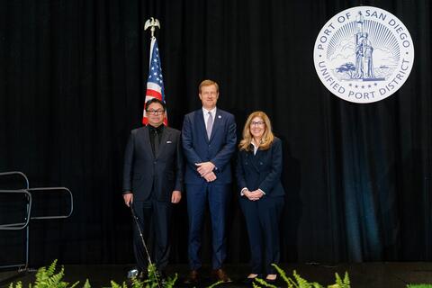 The 2026 officers of the Port of San Diego Board of Port Commissioners - Secretary GilAnthony Ungab, Vice Chair Michael Zucchet, Chair Ann Moore - at the 2026 Swearing-In Ceremony at Gaylord Pacific Resort & Convention Center. (Black backdrop with American flag and Port of San Diego seal.)