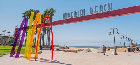 Image of Surfhenge, a colorful entryway that is also art at the Imperial Beach Pier Plaza. 