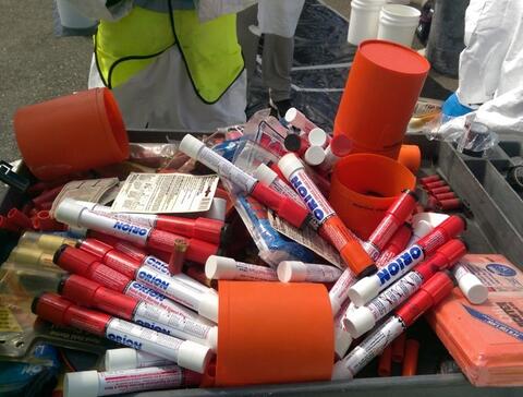 Several one time use marine flares on a table.