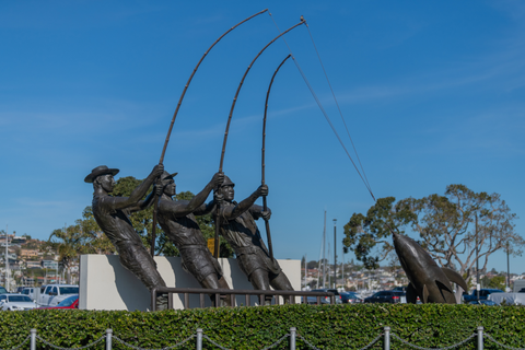 Sculpture of three men catching a tuna. 