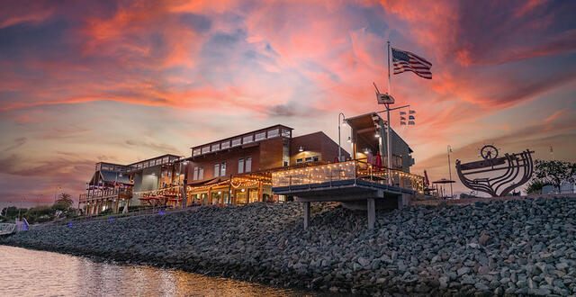 sunset of pink and blue over the National City Aquatic Center