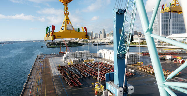 a view froma a crane of cargo being lifted 