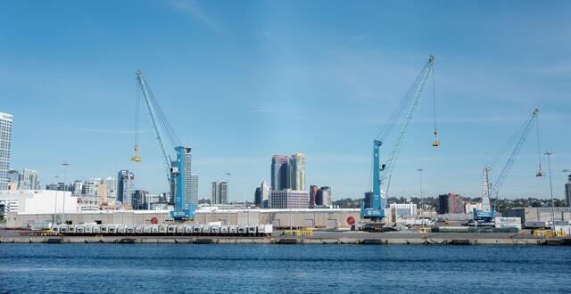View from the bay of Tenth Avenue Marine Terminal with the two all-electric cranes.