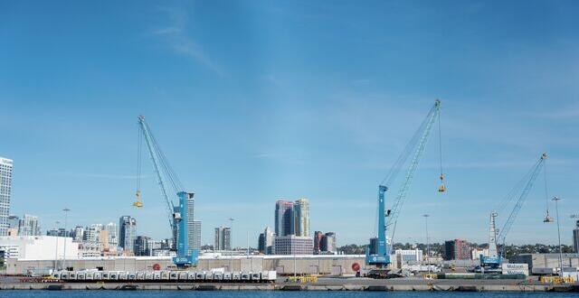 View from the bay of Tenth Avenue Marine Terminal with the two all-electric cranes.