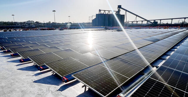 rows of black solar panels on a roof at Tenth Avenue Marine Terminal
