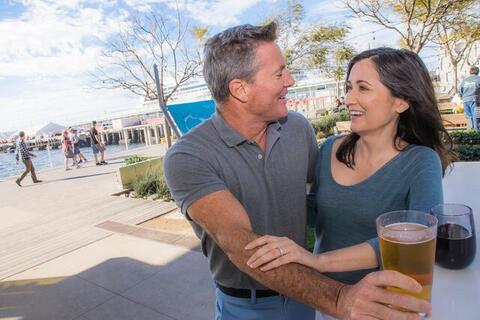 Carnitas Couple Hugging and Drinking