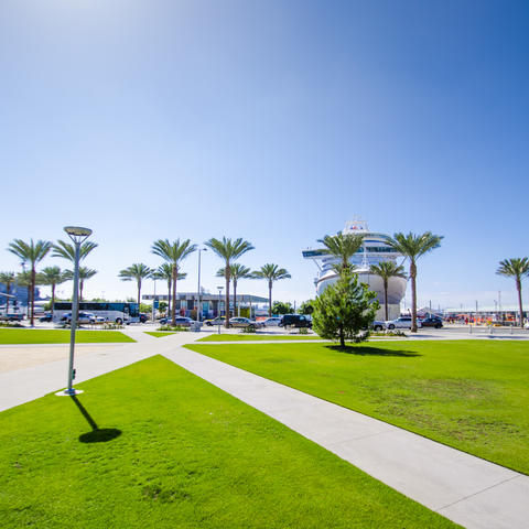 The San Diego sun lights up the brilliant blue sky over Lane Field Park and the North Embarcadero looking westward toward San Diego Bay.