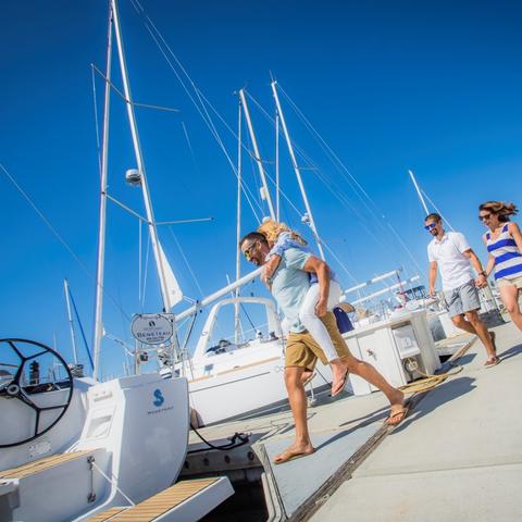 Harbor Island Sailing - adults having fun on the dock Port of San Diego