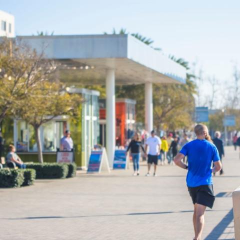 Man running along Broadway Plaza at the Port of San Diego