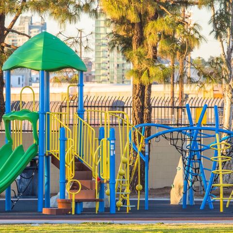 Playground with slides, steps, ladders, nets, and mini rock climbing walls at Port Park in Barrio Logan at the Port of San Diego 