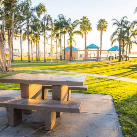 Table, grass, and trees at Port Park in Barrio Logan at the Port of San Diego