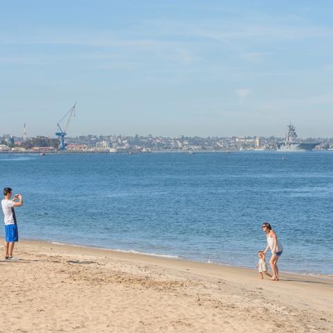 Family at sand beach at Coronado Landing Park at the Port of San Diego