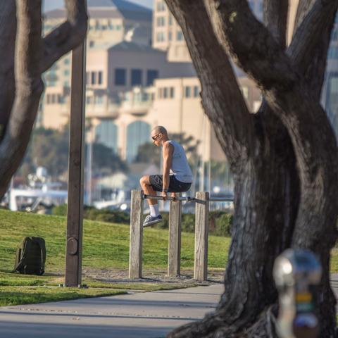Man working out at the exercise station at Embarcadero Marina Park South at the Port of San Diego