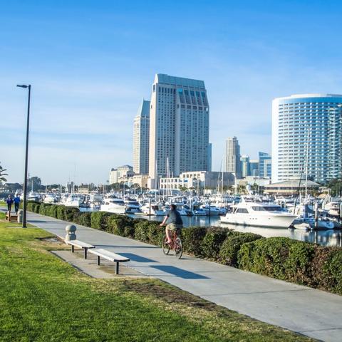 Cyclist and joggers at Embarcadero Marina Park South at the Port of San Diego