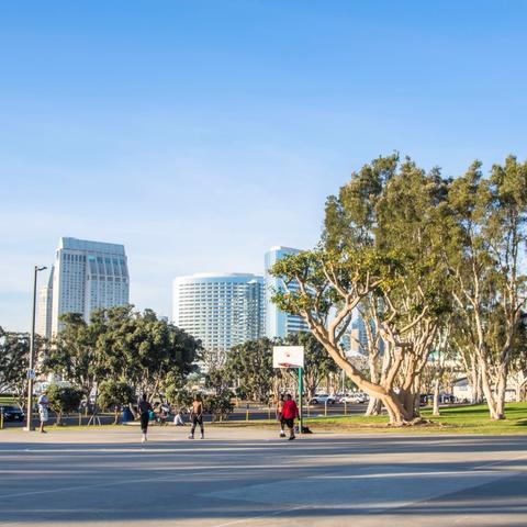 People playing at the basketball court at Embarcadero Marina Park South at the Port of San Diego