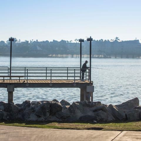 Man fishing at the pier at Embarcadero Marina Park South at the Port of San Diego