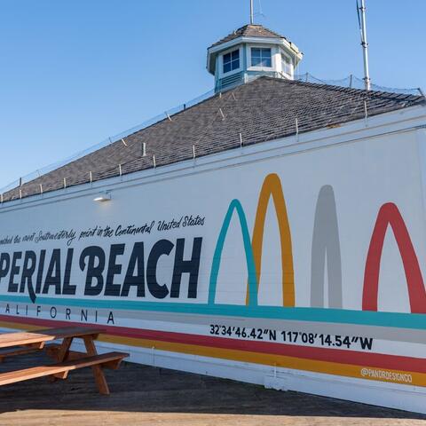 Colorful mural on the back of the Tin Fish Restaurant on the Imperial Beach Pier. The mural says, "You have reached the most southwesterly point in the continental United States. Imperial Beach California."