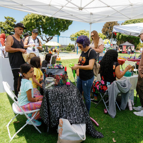 People shopping at vending tents