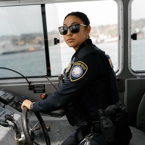 Port of San Diego Harbor Police Office navigates the water piloting a police boat
