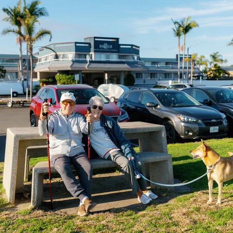 people sit at a picnic table at Shelter Island Shoreline Park