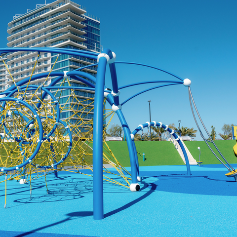 Image of new yellow and blue playground equipment in Harbor Park on Chula Vista Bayfront.