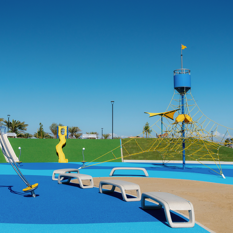 Image of new yellow and blue playground equipment in Harbor Park on Chula Vista Bayfront.