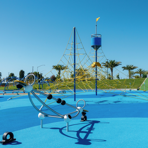 Image of new yellow and blue playground equipment in Harbor Park on Chula Vista Bayfront.